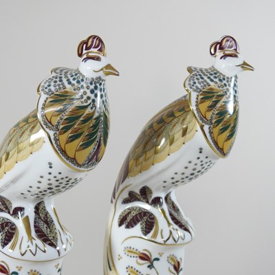 Lot 51 - A pair of Minton 'Flights of Fantasy' porcelain figures of peacocks