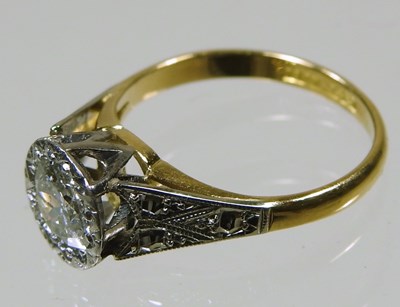 Lot 45 - An 18 carat gold illusion set diamond halo...