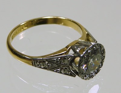 Lot 45 - An 18 carat gold illusion set diamond halo...