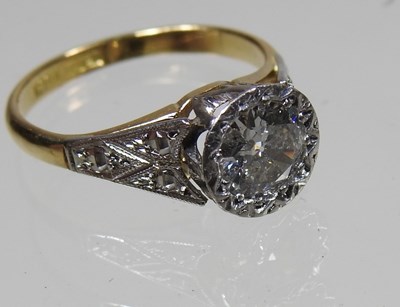 Lot 45 - An 18 carat gold illusion set diamond halo...