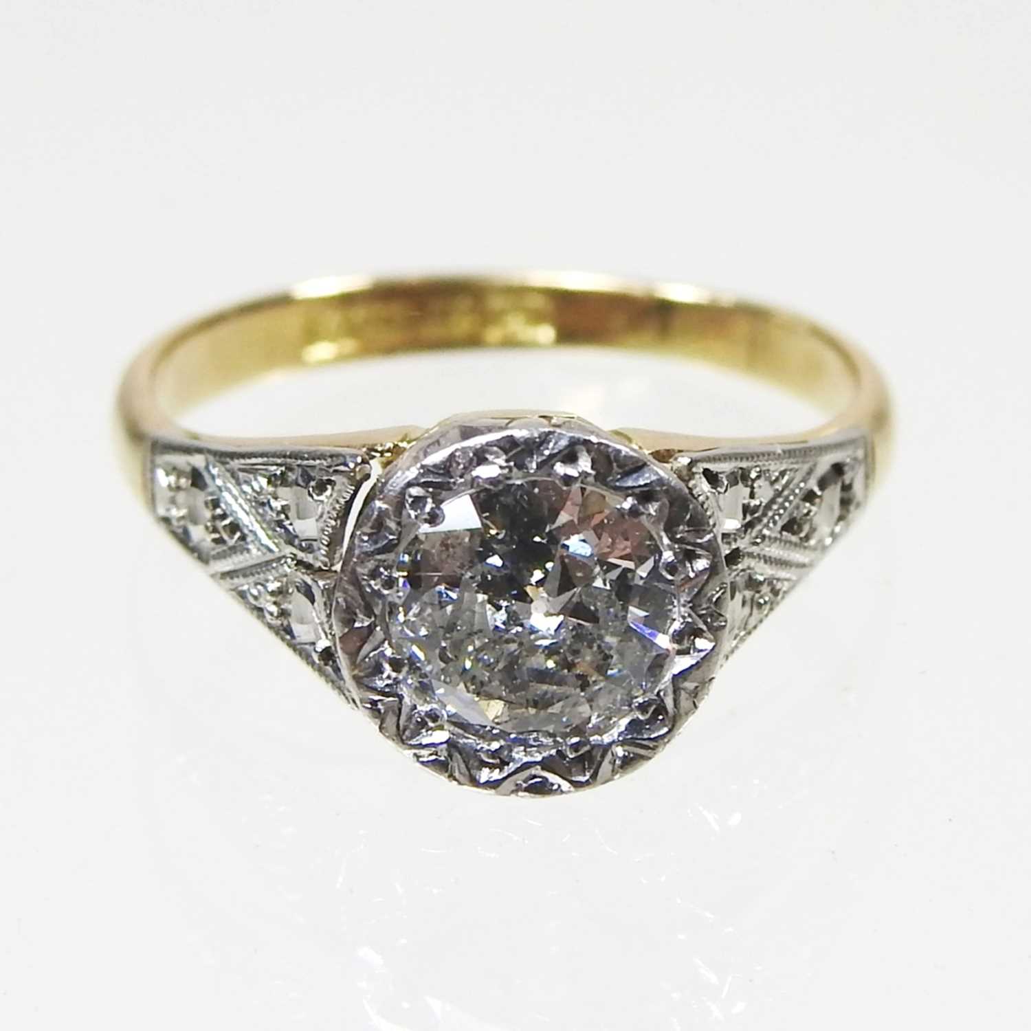 Lot 45 - An 18 carat gold illusion set diamond halo...