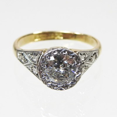 Lot 21 - An 18 carat gold illusion set diamond halo...
