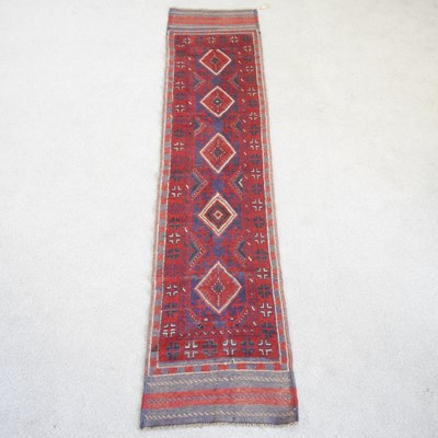 Lot 61 - A Persian runner, with a row of diamonds, on a...
