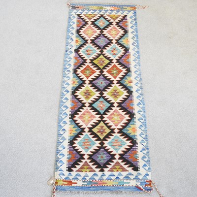 Lot 337 - A Persian kilim runner, with hooked diamonds,...