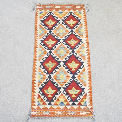 Lot 62 - A Persian kilim runner, with two rows of...