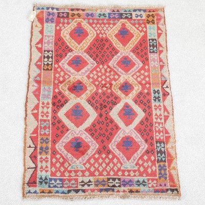 Lot 442 - A baluchi rug, with two rows of diamonds, on a...