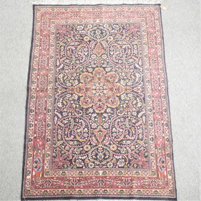 Lot 381 - A Persian woollen rug, with all over foliate design