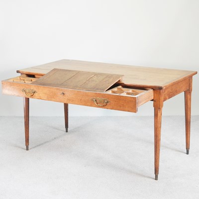 Lot 84 - A 19th century oak clerk's table, the frieze...