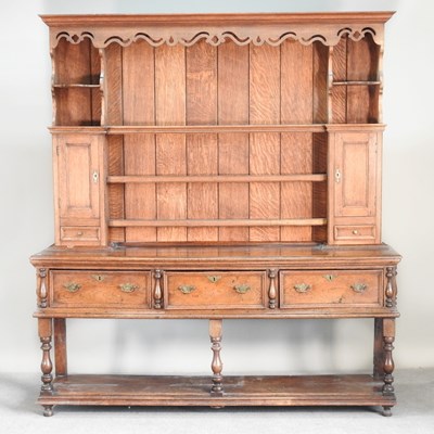 Lot 148 - An 18th century oak dresser, with a boarded...