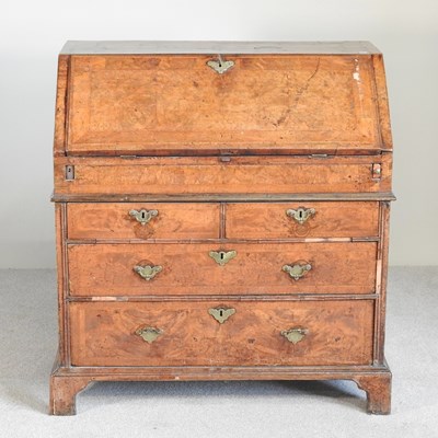 Lot 198 - A George I walnut and crossbanded bureau, the...