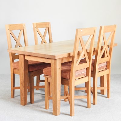 Lot 647 - A modern light oak dining table, together with...