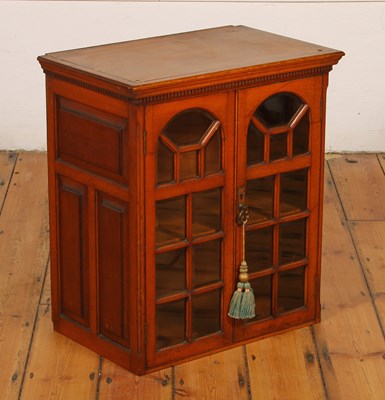Lot 330 - An Edwardian light oak glazed cabinet, having...