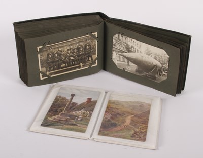 Lot 633 - Two albums of early 20th century postcards, to...