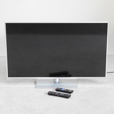 Lot 576 - A panasonic 42" flat screen tv, on stand, on...