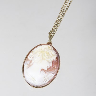 Lot 383 - A 9 carat gold mounted pendant, carved with a...
