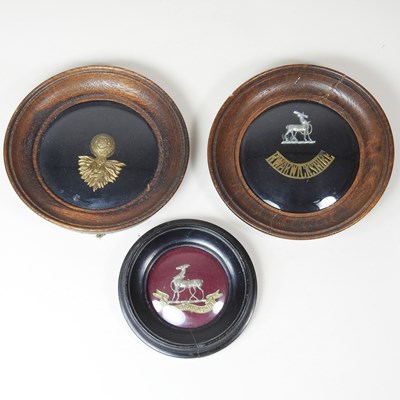 Lot 589 - Three army badges, displayed in convex glazed...