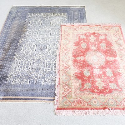 Lot 382 - A Persian woollen carpet, with blue designs,...