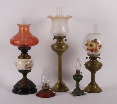 Lot 547 - A collection of Victorian and later oil lamps...