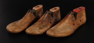 Lot 470 - A set of three vintage wooden shoe lasts