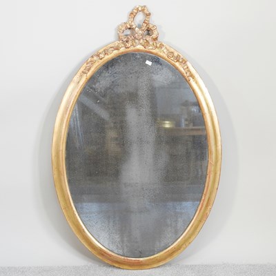 Lot 179 - A Regency and later gilt framed oval wall...