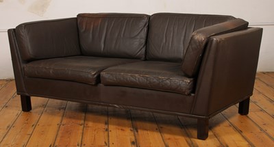 Lot 380 - A Danish brown leather upholstered two seater...