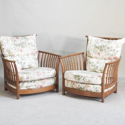Lot 137 - A pair of large Ercol armchairs, with floral...