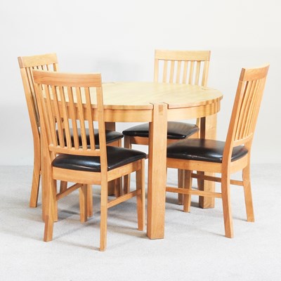 Lot 462 - A modern oak circular dining table, together...