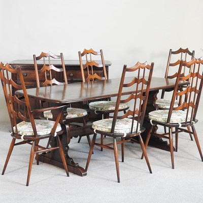 Lot 399 - An Ercol dark elm dining table, together with...