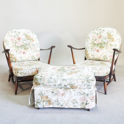 Lot 180 - A pair of dark elm Ercol elm armchairs,...