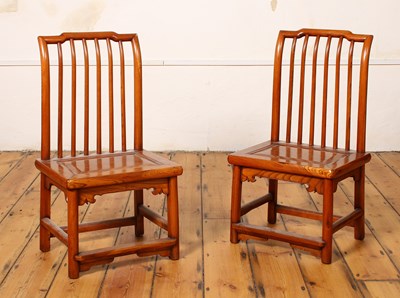 Lot 334 - A pair of Chinese low stick back chairs