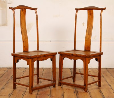Lot 512 - A pair of Chinese elm dining chairs, with...