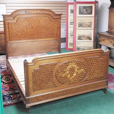 Lot 655 - A French satinwood and parquetry inlaid double...