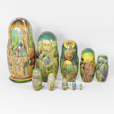 Lot 537 - A painted wooden ten piece Russian doll, 28cm...