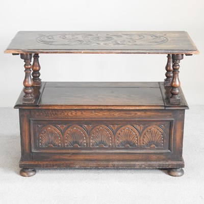 Lot 369 - An early 20th century carved oak monks bench