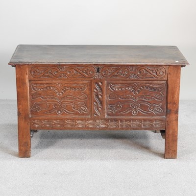 Lot 311 - A small 18th century carved oak coffer, with a...