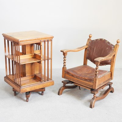 Lot 380 - An Edwardian light oak revolving bookcase,...