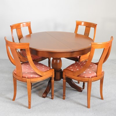 Lot 356 - A modern yew wood circular extending dining...