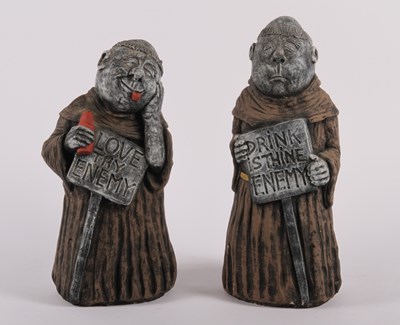 Lot 504 - A pair of reconstituted stone garden figures...