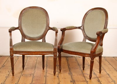 Lot 321 - A pair of French style green upholstered open...