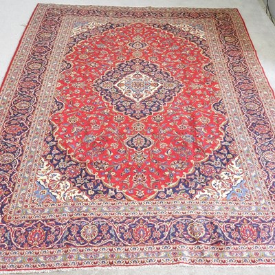 Lot 623 - A Persian kashan carpet, with scrolling...