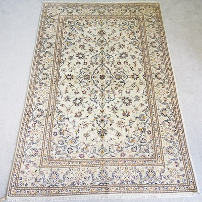 Lot 469 - A Persian kashan carpet, with scrolling...