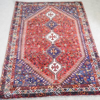 Lot 665 - A Persian qashgai carpet, with a large central...