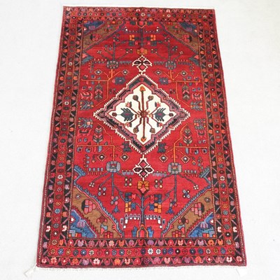Lot 275 - A Persian heriz rug, with a central cream...