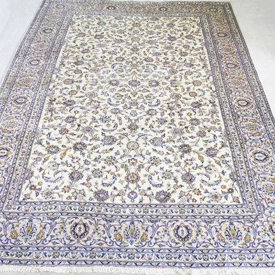 Lot 654 - A Persian kashan carpet, with foliate designs,...