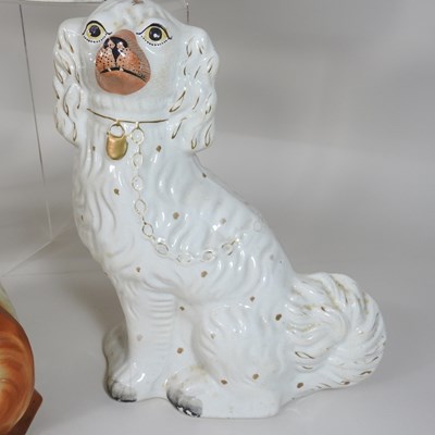 Lot 88 - A pair of 19th century Staffordshire pottery models of seated spaniels