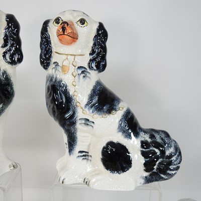 Lot 88 - A pair of 19th century Staffordshire pottery models of seated spaniels