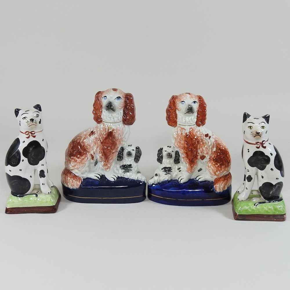 Lot 91 - A rare pair of 19th century Staffordshire pottery dogs