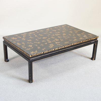 Lot 149 - A modern ebonised and gilt decorated coffee table