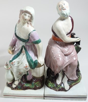 Lot 93 - A pair of early 19th century Staffordshire pottery figures