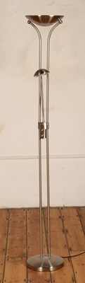 Lot 696 - A modern brushed steel uplighter/reading light,...